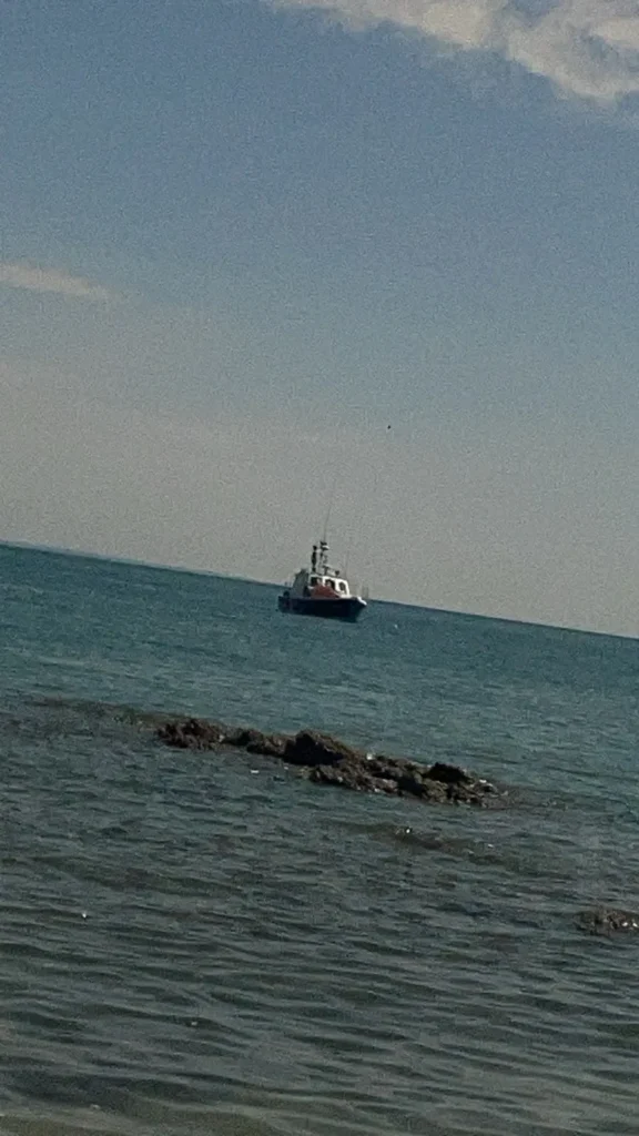 Escort boat waiting offshore in Jersey