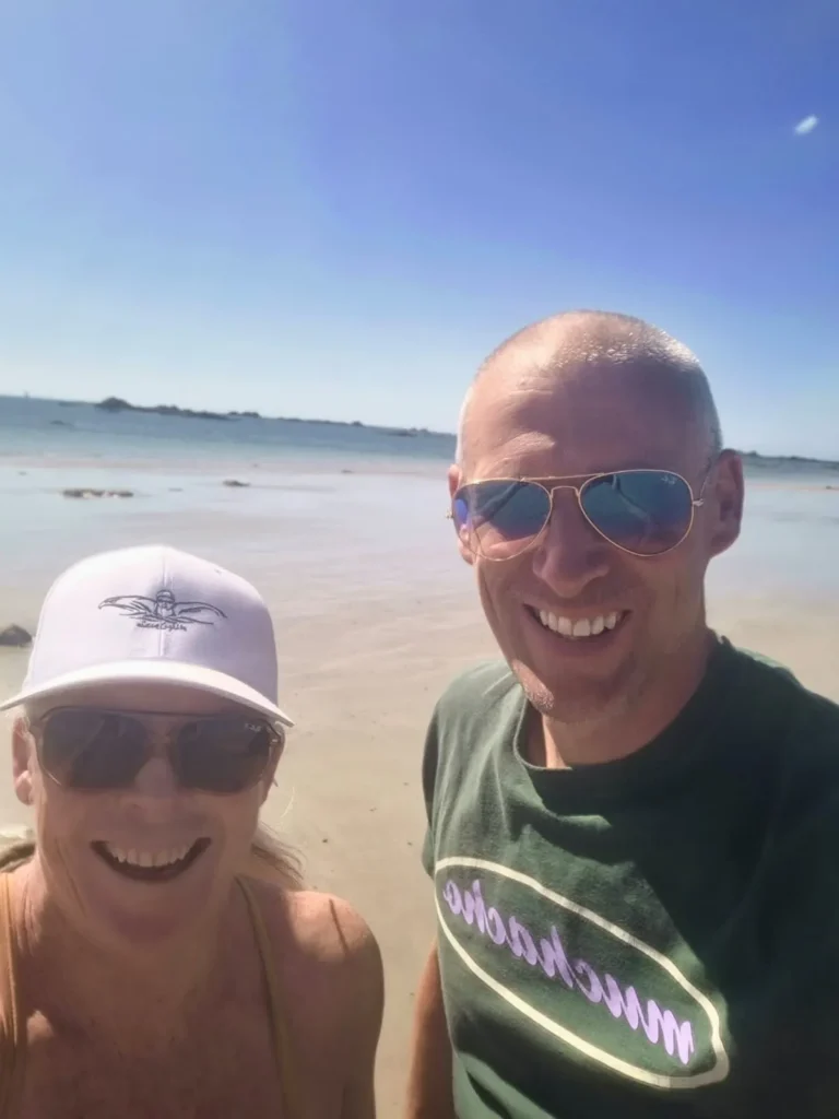 Jo Norman and coach Tim taking a selfie on a beach in Jersey