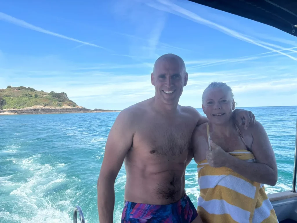 Jo Norman and coach Tim on the boat off the Jersey coast